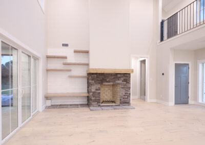 stone fireplace with floating shelves