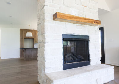 whitewashed stone fireplace